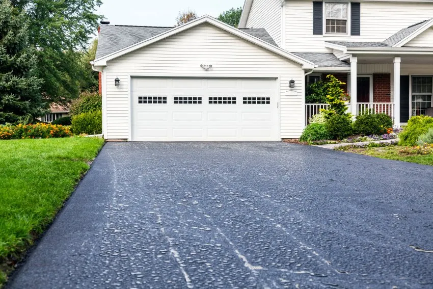 Residential driveway with garage entrance.