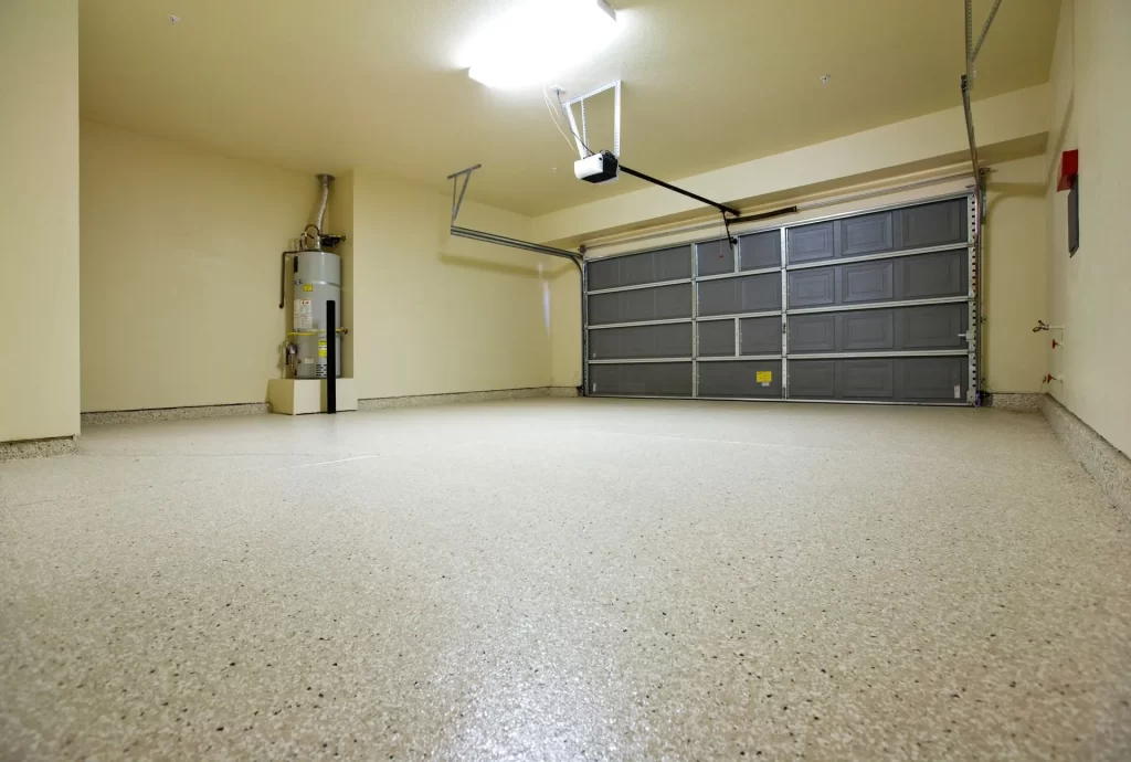 Spacious residential garage interior featuring modern automatic garage door