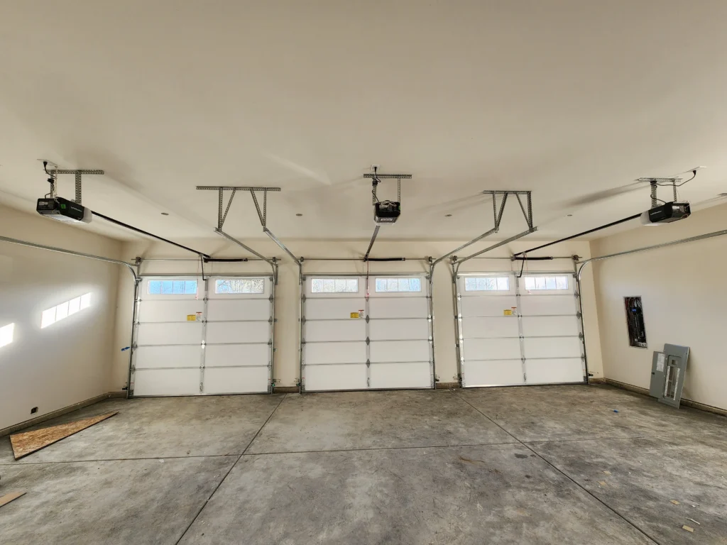 Empty garage with four doors