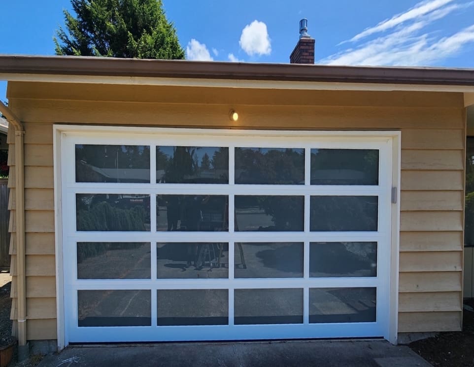 Modern white garage door with windows